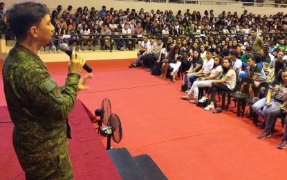 <p><strong>FORUM.</strong> Brig. Gen. Benedicto Arevalo, commander of the Philippine Army’s 303rd Infantry Brigade stationed in Murcia, Negros Occidental, talks before students and teachers of the University of St. La Salle in Bacolod City on the “Deceptive Youth Recruitment Strategy of the Communist Party of the Philippines-New People’s Army-National Democratic Front”. After the forum held on Saturday (Aug. 24, 2019), Arevalo said it is a true exercise of academic freedom when the military is also heard about the lies, deceptions and manipulations of the CPP-NPA-NDF. <em>(Photo courtesy of PA's 303rd Infantry Brigade)</em></p>