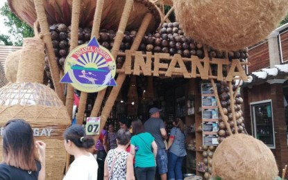 <p><strong>'SUMAN' SELLING LIKE HOTCAKES</strong>. Visitors flock to the booth of Infanta town to buy "suman" and other native food products during the "Niyogyugan Festival" at the capitol grounds in Lucena City on Saturday (Aug. 24, 2019). The town's suman emerged as the overall best-selling product during the 10-day festival. (<em>PNA photo by Loretta Allarey-Paje</em>)</p>