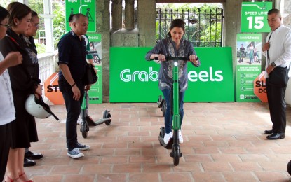 <p><strong>INTRAMUROS SCOOTER.</strong> Tourism Secretary Berna Romulo-Puyat tries the grabwheels scooter which will roll next month in Intramuros as part of DOT and GrabPH's freshly-forged partnership on Wednesday (Aug. 28, 2019). GrabPH committed to deploy 30 scooters inside the famous walled city. <em>(PNA photo by Gil Calinga)</em></p>