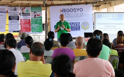 <p><strong>SERVING THE BARANGAYS</strong>. Engiemar Tupas, senior trade and industry development specialist of Department of Trade and Industry-Negros Occidental, gives a talk before the participants of the “Negosyo Serbisyo sa Barangay” in Barangay Pacol, Valladolid town on Tuesday (Aug. 27, 2019). The program is being implemented based on the directive of Trade Secretary Ramon Lopez to bring the agency’s services to the countryside. <em>(Photo courtesy of DTI-Negros Occidental)</em></p>