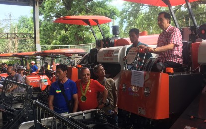 <p><strong>EQUIPMENT FOR FARMERS</strong>. Department of Agriculture Secretary William Dar leads the awarding of various farm machineries and equipment to Ilocos Norte farmers in Batac City on Friday (Aug. 30, 2019). The DA has also opened more credit windows for farmers to boost their productivity. <em>(Photo by Leilanie G. Adriano)</em></p>