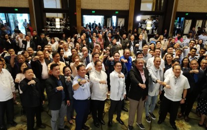 <p><strong>SAFER MARITIME TRIPS</strong>. DOTr Secretary Arthur Tugade (fourth from right), other officials from DOTr, MARINA, PPA, the Philippine Coast Guard, and private partners from the maritime sector pose for a photo during the Maritime Safety Summit for Domestic Shipping at the Diamond Hotel in Roxas Boulevard, Manila on August 30, 2019. Following the summit, Tugade led a press conference where he underscored the stricter enforcement of the phaseout of wooden-hull passenger bancas. <em>(PNA photo by Raymond Carl Dela Cruz)</em></p>