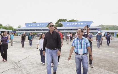 <p><strong>AIRPORT REHAB</strong>. Communications Secretary Martin M. Andanar and CAAP Surigao Manager Junelito P. Abrazado lead the second inspection of the Surigao City Airport’s runway rehabilitation on Friday, August 30, 2019. The officials said the airport's rehab timeline remains intact. <em>(Photo courtesy of PCOO)</em></p>