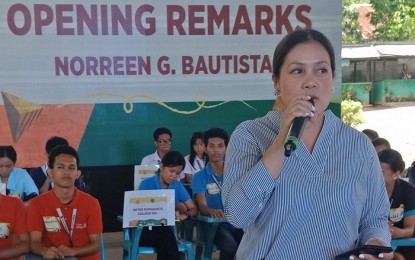 <p><strong>BATTLE OF THE BRAINS.</strong> Norreen Bautista of the Energy Development Corporation's Corporate Social Responsibility Department for Negros Island and Mt. Apo gives her opening message during the Battle of the Brains science competition in Valencia, Negros Oriental on Thursday, Aug. 29, 2019. A total of 77 schools in Negros Island are participating in the BOTB, which is now on its fourth year. <em>(Photo by Juancho Gallarde)</em></p>