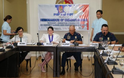 <p><strong>TOPCOP MOU SIGNING. </strong>Philippine National Police (PNP) Chief Gen. Oscar Albayalde and Department of Tourism (DoT) Secretary Secretary Bernadette Romulo-Puyat sign a memorandum of understanding (MOU) on iinstitutionalizing the Tourist-Oriented Police for community Order and Protection (TOPCOP) in Camp Crame on Monday (Sept. 2, 2019). The pact is aimed at ensuring the availability of tourist police in tourist destinations nationwide. <em>(PNA photo by Christopher Lloyd Caliwan)</em></p>
