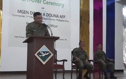 <p><strong>TASK GROUP CEBU</strong>. Col. Jerry T. Borja (on the rostrum), the new commander of Task Group Cebu, Bohol, and Siquijor, delivers a message during the turnover ceremony at the Bondad Hall of the Central Command in Camp Lapu-Lapu, Cebu City on Tuesday (Sept. 3, 2019). Borja said he takes it as a challenge to retain the insurgency-free status of the three provinces, as Maj. Gen. Dinoh Dolina, commander of the 3ID, and Col. Noel T. Baluyan, commander of the 302nd Infantry (Achiever) Brigade, listen. <em>(PNA photo by John Rey Saavedra)</em></p>
