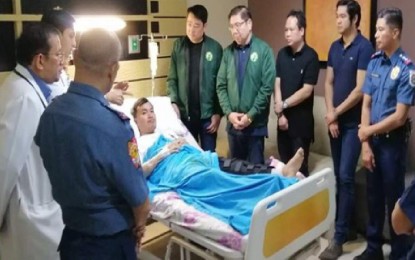<p><strong>CAVITE COP RECOGNIZED</strong>. General Trias City Mayor Antonio Ferrer and Cavite 6th District Rep. Luis Ferrer IV, along with Cavite Police Provincial Director, Col. William Segun and GenTri acting chief of police, Lt. Col. Marlo Solero confer the Wounded Personnel Medal on Corporal Redentor Betita, a member of the city’s Drug Enforcement Unit (DEU) team, at the GenTri Doctors Hospital on Sept. 2, 2019. <em>(PNA photo by Dennis Abrina)</em></p>
