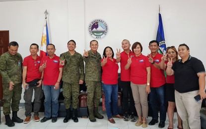 <p><strong>JOURNALIST SAFETY.</strong> Officers of the Mindanao Independent Press Council, led by president Editha Z. Caduaya, and top Eastern Mindanao Command officials pose for posterity following a two-hour dialogue to tackle the “red-tagging” of several media personalities in the island. Both parties agree to implement concrete measures to ensure the safety of threatened journalists. <em>(Contributed photo)</em></p>