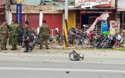 <p><strong>EXTORTION BLAST</strong>. Police and military authorities check the blast site in Isulan, Sultan Kudarat where eight victims were injured on Saturday (Sept. 7, 2019). Investigators are eyeing extortion as the motive behind the incident. <em>(Photo courtesy of Isulan MPS)</em></p>
