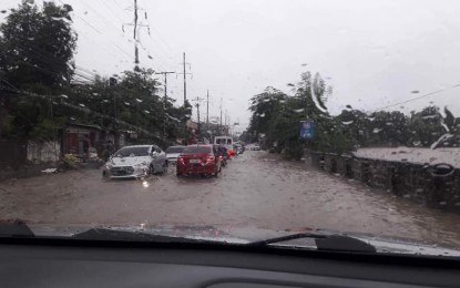 <p>A flooded street in Camiling, Tarlac.<em> (Photo from the Facebook page of Camiling MDRRMO)</em></p>