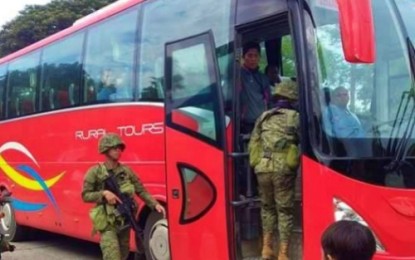<p><br /><strong>TIGHT SECURITY.</strong> Elements of Army’s 7th Infantry Battalion inspect a bus along the national highway in Carmen, North Cotabato following the shootout between a drug suspect and checkpoint personnel on Sunday, Sept. 8, 2019. <em>(Photo courtesy of 7IB)</em></p>