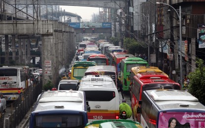 <p><strong>EDSA BUSES.</strong> Public utility buses fill the streets of Edsa before the coronavirus disease 2019 pandemic hit the country. The Department of Transportation on Wednesday said three more city bus routes will open by Thursday, bringing the total active city bus routes in the region at 20. <em>(PNA file photo)</em></p>