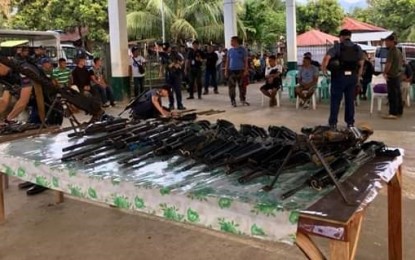 <p><strong>ARMS TURNOVER.</strong> Personnel of the Cadiz City Police Station in Negros Occidental receive the firearms, ammunition, and explosives turned over by former combatants of the Revolutionary Proletarian Army-Alex Boncayao Brigade Tabara-Paduano Group (TPG) at Sitio Alimatoc in Barangay Celestino Villacin on Sunday (Sept. 8, 2019). The turnover is in preparation for the disposition of arms and forces of the TPG, which is currently finalizing a peace agreement with the government. <em>(Photo courtesy of Cadiz City Police Station)</em></p>