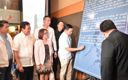 <p><strong>RDC-RPOC JOINT RESOLUTION</strong>. Public Works Secretary Mark Villar signs the approved joint resolution of the Regional Development Council and Regional Peace and Order Council in Metro Manila of the 'whole-of-nation' approach in ending insurgency in the country at the PICC in Pasay City on Tuesday (Sept. 10). Villar is the National Capital Region Cabinet Officer for Regional Development and Security (CORDS) and National Capital Region Task Force to End Local Communist Armed Conflict (NTF-ELCAC) infrastructure cluster head. <em>(Photos courtesy of DPWH)</em></p>