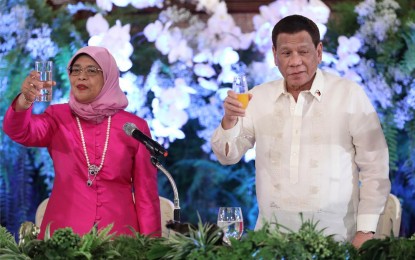<p><strong>EIGHT DEALS</strong>. President Rodrigo Roa Duterte and Republic of Singapore President Halimah Yacob raise their glasses for a toast during the state banquet at the Malacañan Palace on September 9, 2019. The Philippines and Singapore signed eight agreements during the state visit of the first female president of Singapore. <em>(Ace Morandante/Presidential Photo)</em></p>
<p><em> </em></p>
<p> </p>
<p> </p>
<p> </p>