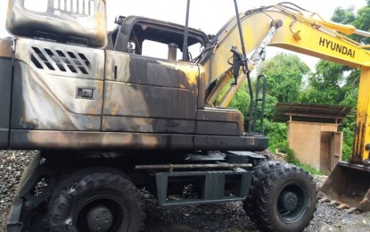 <p><strong>BURNED.</strong> A torched backhoe at Guimbal town, Iloilo. Suspected members of New People's Army burned the backhoe on Wednesday night (Sept. 11, 2019). <em>(Photo courtesy of Philippine Army's 61IB PIO)</em></p>