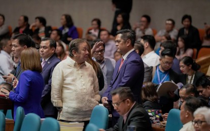 <p><strong>PCOO BUDGET</strong>. Communications Secretary Martin M. Andanar (right) chats with Buhay party-list Rep. Lito Atienza (left) after the floor interpellation of the budget of the Presidential Communications Operations Office for 2020 on Wednesday (Sept. 11) at the Batasan Pambansa complex in Quezon City. <em>(PCOO photo)</em></p>