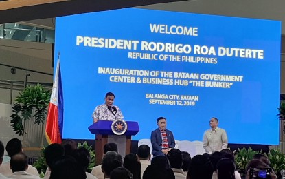 <p><strong>PUBLIC-PRIVATE PARTNERSHIP. </strong>President Rodrigo R. Duterte delivers his message during the inauguration of the Bataan Government Center and Business Hub called “The Bunker” at the capitol compound in Balanga City, Bataan on Thursday, September 12, 2019.  The President said the seven-storey building is one of the success stories of Public-Private Partnership. <em>(Photo by Ernie Esconde)</em></p>