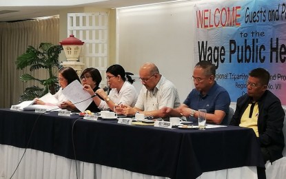 <p><strong>PUBLIC HEARING.</strong> The Regional Tripartite Wage and Productivity Board in Region 7 (RTWPB-7) conducts a public hearing on the petition for a minimum wage hike in Dumaguete City on Tuesday (Sept. 17, 2019). Present were (L-R) Board Secretary Grace Carreon, Department of Trade and Industry-7 Director Asteria Caberte, Department of Labor and Employment-7 Director Salome Siaton, National Economic Development Authority-7 Director Efren Carreon, Philip Tan representing the management sector, and Jose Tomongha representing the labor sector.<em> (Photo by Judy Flores Partlow)</em></p>