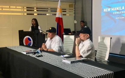 <p><strong>AIRPORT CONCESSION AGREEMENT</strong>. Transportation Secretary Arthur Tugade (left) and San Miguel Corp. (SMC) President and Chief Operating Officer Ramon Ang (right) lead the signing of the concession agreement for the Bulacan International Airport on Wednesday (Sept. 18, 2019). The SMC formally received the Notice of Award for the project on August 14, 2019, shortly after the opening of bids where its proposal went uncontested. <em>(Contributed photo)</em></p>