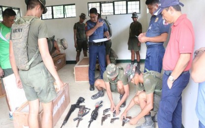 <p><strong>YIELDED GUNS.</strong> Government troops account guns turned over by former Revolutionary Proletarian Army–Alex Boncayao Brigade rebels. Brig. Gen. Rene Pamuspusan, PRO-6 director, said the surrender of the rebels has a "huge impact" on the government's anti-insurgency campaign. <em>(Photo courtesy of Philippine Army's 3ID)</em></p>