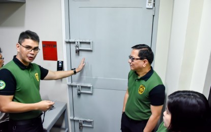 <p><strong>EVIDENCE ROOM.</strong> PDEA Director General Aaron Aquino (right) and Laboratory Service Director and spokesperson Derrick Carreon (left) give the media a tour at the 'evidence room' of the agency on Thursday (Sept. 19, 2019), to disprove allegations of recycling of illegal drugs seized in its operations. The PDEA evidence room currently contains 3.6 tons of dangerous drugs worth PHP22 billion. <em>(Photo courtesy of PDEA Public Information Office)</em></p>
