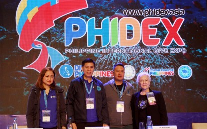 <p><strong>DIVE EXPO.</strong> Officials of the Department of Tourism (DOT) and famous diving enthusiasts grace the opening of the Philippine International Dive Expo (Phidex) at the Conrad Hotel in Pasay City on Friday (Sept. 20, 2019). Photo shows (from left) OIC-Executive Director and head of the DOT office of product and market development's dive team Rowena Sorioso; DOT Undersecretary Benito C. Bengzon; award-winning underwater photographer and commissioner of the Philippine Commission on Sports Scuba Diving, Bo Mancao; and internationally-published photographer, author, lecturer, environmentalist, and leader of Dive Travel Lynn Funkhouser. <em>(PNA photo by Gil Calinga)</em></p>