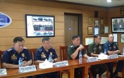<p><strong>PROBE INTO PMA CADET'S DEATH.</strong> Officials of the Cordillera police and the Philippine Military Academy identify three persons of interest in the death of 4th Class Cadet Darwin Dormitorio, in a press briefing on Friday (Sept. 20, 2019). Autopsy results showed Dormitorio died on September 18 due to trauma caused by a blunt force during hazing.<em> (PNA photo by Dionisio Dennis Jr.)</em></p>