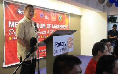 <p><strong>COMMITMENT TO END POLIO.</strong> Health Secretary Francisco Duque III delivers his message on the sidelines of the signing of a memorandum of agreement to end polio with Rotary International's 10 districts in Quezon City on Friday (Sept. 20, 2019). Under the agreement, the DOH and the non-government organization will work together in beefing up awareness on the importance of anti-polio vaccination for children. <em>(Photo courtesy of the Department of Health)</em></p>