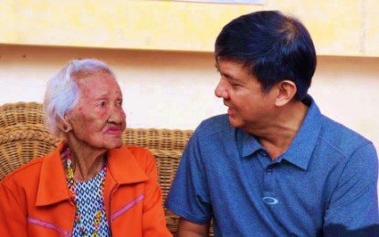 <p><strong>CARING FOR SENIOR CITIZENS.</strong> Kidapawan City Mayor Joseph Evangelista (right) speaks with an elderly citizen during a recent senior citizens’ event in the locality. The mayor has instructed the scheduled door-to-door delivery to senior citizens of their free maintenance medicine that commenced on Sept. 13, 2019. <em>(Photo courtesy of Kidapawan CIO)</em></p>