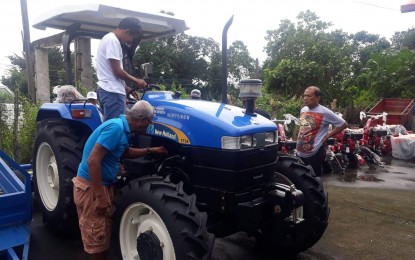 <p><strong>EQUIPMENT FOR FARMERS.</strong> Farmer-beneficiaries inspect the tractor they received from the Department of Agrarian Reform (DAR) 1 (Ilocos region) in Sta. Maria, Pangasinan on Friday (Sept. 20, 2019). A total of 2,535 farmers in Pangasinan will benefit from the PHP5 million worth of machinery and equipment from DAR-1. <em>(Photo courtesy of Enzo Austria Jr.)</em></p>