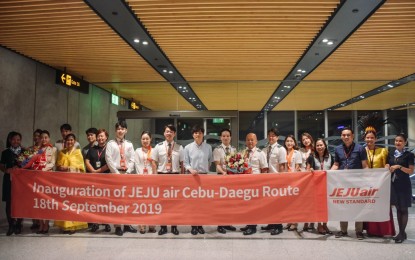 <p><strong>TOP DESTINATION</strong>. The delegates from Daegu, South Korea pose with officials and staff of the Mactan-Cebu International Airport (MCIA) at the airport lobby shortly after their arrival on board the maiden Daegu-Cebu flight of Jeju Air on Tuesday (Sept. 17, 2019). The GMR Megawide Cebu Airport Corporation (GMCAC), the private operator of the MCIA, said the Daegu flights will boost Cebu's edge as top destination for international visitors. <em>(Photo contributed by Avigael M. Ratcliffe/GMCAC)</em></p>