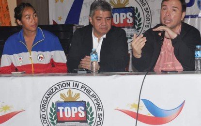 <p><strong>TRIATHLON</strong>. Southeast Asian Games gold medalist Maria Claire Adorna (left) graces the 40th “Usapang Sports” forum presented by the Tabloids Organization in Philippine Sports (TOPS) at the National Press Club in Intramuros, Manila on Sept. 17, 2019. Adorna said the Filipino triathletes have the capabilities to come with a “resounding” campaign in the 30th SEA Games in Manila from Nov. 30 to Dec. 11 this year. Also in photo are TOPS president Ed Andaya and Games and Amusements Board (GAB) Chairman Abraham “Baham” Mitra. <em><strong>(Photo courtesy of TOPS)</strong></em></p>