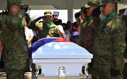 <p><strong>LAID TO REST.</strong> Soldiers of the Army’s 4th Infantry Division salute Philippine Military Academy (PMA) cadet 4th class Darwin Dormitorio before his remains are buried at the Cagayan de Oro Gardens in Barangay Lumbia, Cagayan de Oro City, on Wednesday (Sept. 25, 2019). Col. Claro Unson, PMA deputy dean for academics, said failure to strictly enforce the Anti-Hazing Law was one of the shortcomings of officials of the PMA that led to Dormitorio’s death.<em> (Photo by Jigger J. Jerusalem)</em></p>
