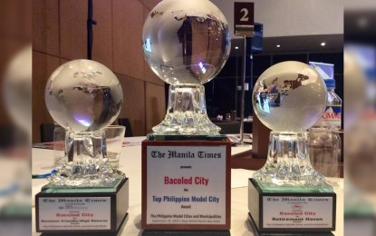 <p><strong>RECOGNITION.</strong> The trophies received by the City of Bacolod as Top Philippine Model City for 2019 (center), as well as Business-Friendly/High Returns and Retirement Haven, at The Manila Times Search for the Philippine Model Cities and Municipalities. The awards were received by Mayor Evelio Leonardia and other city officials in rites held at the New World Manila Bay Hotel on Wednesday afternoon (Sept. 25, 2019). <em>(Photo courtesy of Bacolod City PIO)</em></p>