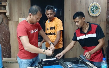 <p><strong>CAPTURED.</strong> PNP-AKG policemen subject NasIrin Baladji to booking procedures after his arrest in Zamboanga Sibugay on Wednesday (Sept. 25, 2019). Baladji is wanted for the kidnapping of three persons, including a Jordanian journalist in Mindanao. <em>(Photo courtesy of PNP-AKG)</em></p>
