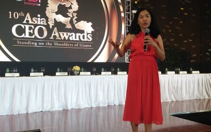 <p style="text-align: left;"><strong>NO WAY BUT UP.</strong> Domestic helper-turned-entrepreneur Rebecca Bustamante, president of the Asia CEO Awards, urges aspiring entrepreneurs to work hard to achieve their goals, at the 10th Asia CEO Awards in Pasay City on Friday (Sept. 20, 2019). Now on its 10th year, the Asia CEO Awards honors top-performing Filipino business leaders across Asia. <em>(PNA photo by Cristina Arayata)</em></p>