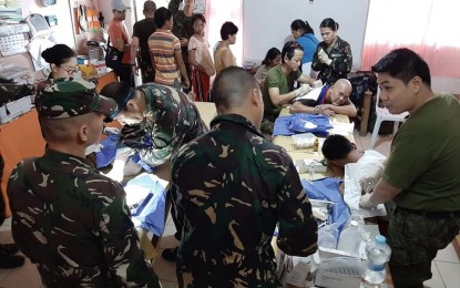 <p><strong>MEDICAL MISSION.</strong> Reservist-surgeons perform minor operations during a medical mission at Catarman Integrated School in Liloan, Cebu on Sunday (Sept. 29, 2019). Around 2,000 residents from Barangay Catarman and its neighboring villages benefited from different services, ranging from free medical check-up with free medicines, tooth extraction, massage therapy, and haircut, among others.<em> (Photo courtesy of Lt. Col. Ed Malig-on)</em></p>