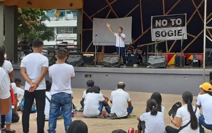 <p><strong>NO TO SOGIE.</strong> Pastor Spencer Kent Aguilar of God's Love Ministry shares a testimony as a former transgender during the prayer rally at the Evelio B. Javier Park in San Jose de Buenavista, Antique on Monday (Sept. 30, 2019). Pastors and other religious people in Antique oppose the SOGIE bills as they believe it is harmful to the Philippines being a Christian nation. <em>(PNA photo by Annabel Consuelo J. Petinglay)</em></p>
