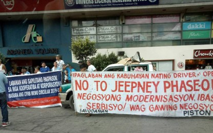 <p><strong>TRANSPORT HOLIDAY</strong>. Protesters against the planned phase-out of non-compliant PUVs as part of the PUV modernization program of the Duterte administration in Caloocan City on Monday. The LTFRB on Tuesday said it will soon issue show cause orders against operators confirmed to have joined the transport holiday as it was in violation of the franchise granted to them by the government. <em>(Photo courtesy of DOTr)</em></p>