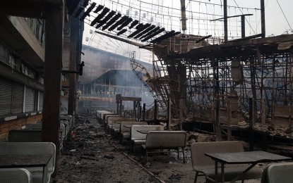 <p><strong>ROASTED RIDES.</strong> Smoke surfaces from the fire that razed one of the attractions beside the food stalls inside theme park Star City in Pasay City on Wednesday (Oct. 2, 2019). The DOLE said it will provide emergency employment assistance to some 500 employees of the amusement park. <em>(Photo courtesy of Pasay City Command, Control, Communication and Information Center)</em></p>