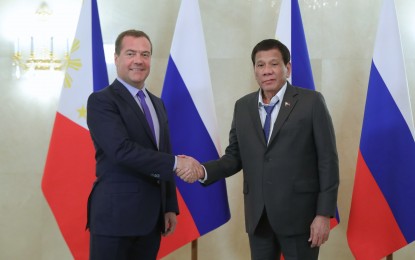 <p><strong>DUTERTE IN RUSSIA.</strong> President Rodrigo R. Duterte and Russian Prime Minister Dmitry Medvedev shake hands before the start of their bilateral meeting at the Prime Minister's Office in Moscow on October 2, 2019. Duterte is in Russia for a five-day state visit. <em>(Presidential Photo)</em></p>