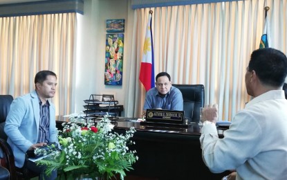 <p><strong>EDUCATIONAL PROGRAMS.</strong> Dr. Roel Bermejo (left), newly-installed schools’ division superintendent of the Department of Education (DepEd) in Iloilo meets Governor Arthur Defensor Jr. at the capitol on Tuesday (Oct. 1, 2019). He said he had gathered the support of the Iloilo provincial government for the implementation of educational programs. <em>(PNA photo by Gail Momblan)</em></p>