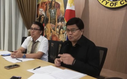 <p><strong>POVERTY REDUCTION PROJECT.</strong> Cebu City Mayor Edgardo Labella (right) emphasizes a point during a press briefing after signing a memorandum of agreement with National Anti-Poverty Commission (NAPC) Secretary Noel Felongco (left) to implement a PHP3-million trading post project, held at the Cebu City Hall on Thursday afternoon (Oct. 3, 2019). At the trading post, agricultural and fishery products of city upland farmers and fisherfolk, as well as urban poor will be sold at cheaper price. <em>(PNA photo by John Rey Saavedra)</em></p>
