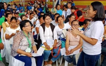 <p><strong>'DAGYAWAN'.</strong> Residents and barangay officials raise their issues and concerns during the "Dagyawan: Talakayan ng Mamayan" in Guihulngan City, Negros Oriental. The activity, held last month, was the first of a series, spearheaded by the Negros Oriental Task Force to End Local Communist Armed Conflict. <em>(File photo by Juancho Gallarde)</em></p>