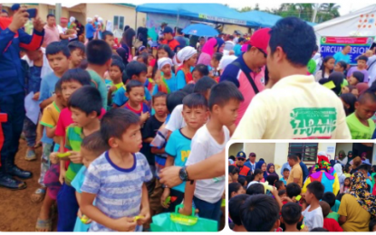 <p><strong>MARAWI OUTREACH MISSION.</strong> A relief worker distributes hygiene kits to the children during the daylong outreach mission by the Bangsamoro Autonomous Region in Muslim Mindanao (BARMM) government under its Project Tabang in Barangay Boganga, Marawi City, Lanao del Sur on Friday (Oct. 4). Some 1,000 residents (inset) who are mostly victims of the Marawi siege in 2017, benefitted from the program. <em>(Photo courtesy of READI-BARMM)</em></p>