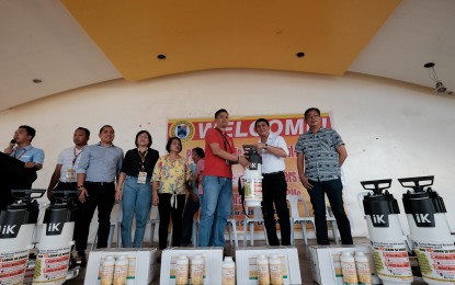 <p><strong>DENGUE CAMPAIGN.</strong> Governor Nelson Dayanghirang (2nd from right) turns over two fog machines to personnel of the Public Health Office to be used in case of a dengue outbreak Friday (Oct. 4, 2019). The governor made every Friday a day for a provincial-wide cleanup activity in Davao Oriental. <em>(Photo by Davao Oriental PIO)</em></p>