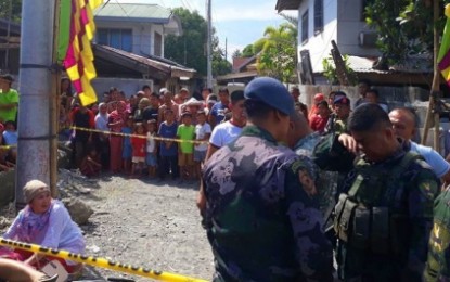 <p><strong>AMBUSHED COP.</strong> A police officer weeps (right) as a woman (left) attends to the remains of Patrolman Asraph Pasandalan Mato of the Police Regional Mobile Force Battalion – Bangsamoro Autonomous Region in Muslim Mindanao who was ambushed in Barangay Gang, Sultan Kudarat, Maguindanao on Sunday, Oct. 6, 2019. A police tracking team is following up on a lead that is vital to the case. <em>(Photo by Sultan Kudarat MPS)</em></p>
