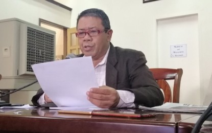 <p><strong>CLOSURE.</strong> Jenelieto Atillo, spokesperson of the Department of Education 11 (Davao region), reads the agency's decision ordering the closure of 55 Salugpongan schools in the region on Monday (Oct. 8, 2019). The decision was based on the findings of the five-man fact finding committee created by DepEd-11 in August to investigate Salugpongan schools for regulatory violations and alleged links to the communist rebel movement. <em>(PNA photo by Che Palicte)</em></p>