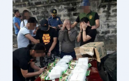 <p><strong>BUY-BUST</strong>.  An operative inspects PHP68 million worth of suspected shabu seized in a drug buy-bust at Barangay Sienna in Quezon City on Tuesday (Oct. 8, 2019).  The operatives arrested three suspects, including a Chinese national. <em>(Photo courtesy of PDEA)</em></p>